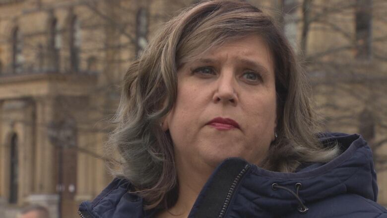 Closeup shot of a woman looking off into the distance. 