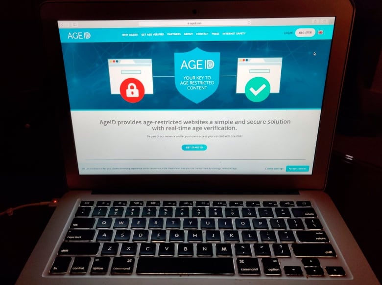 This photo taken in London on Monday July 8, 2019, shows a laptop screen displaying the website for AgeID, an age verification system for the British governments planned online porn block