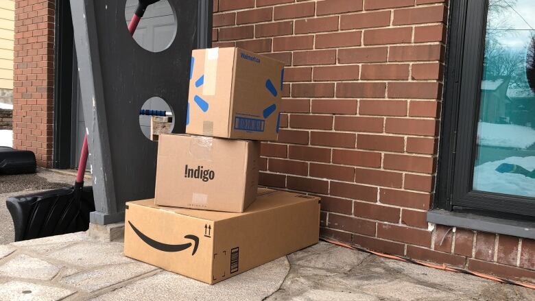 Amazon packages left on a porch.