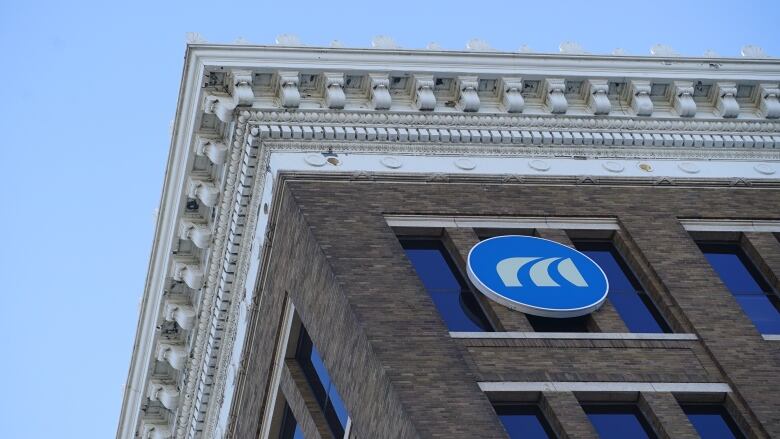 A Manitoba Public Insurance sign is shown on a building.