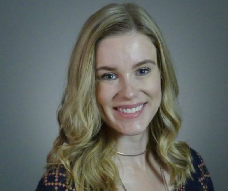 A headshot of a woman with blonde hair.