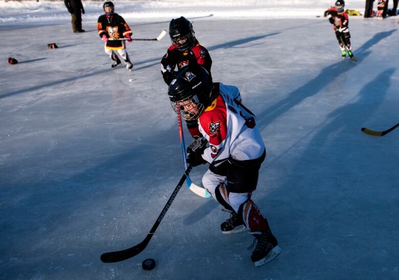 kid playing hockey