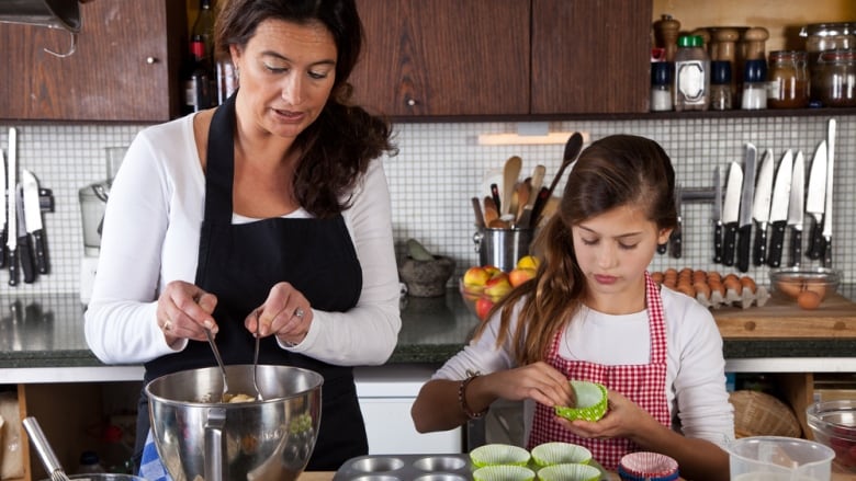 a mother and child baking