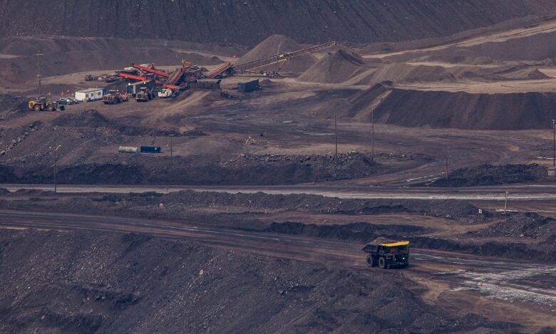 Heavy equipment operates at an open-pit coal mine in B.C., just west of the Alberta border. 