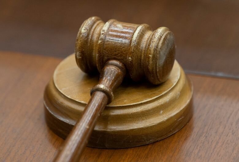 A judge's gavel on a desk.