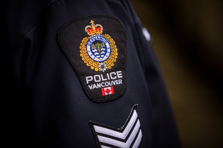 A close-up picture of a Vancouver Police Department shoulder badge.