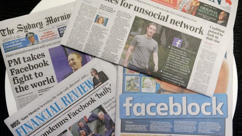 Front pages of Australian newspapers are displayed featuring stories about Facebook in Sydney, on Friday. In a surprise retaliatory move Thursday, Facebook blocked Australians from sharing news stories, escalating a fight with the government over whether powerful tech companies should have to pay news organizations for content. (AP Photo/Rick Rycroft)