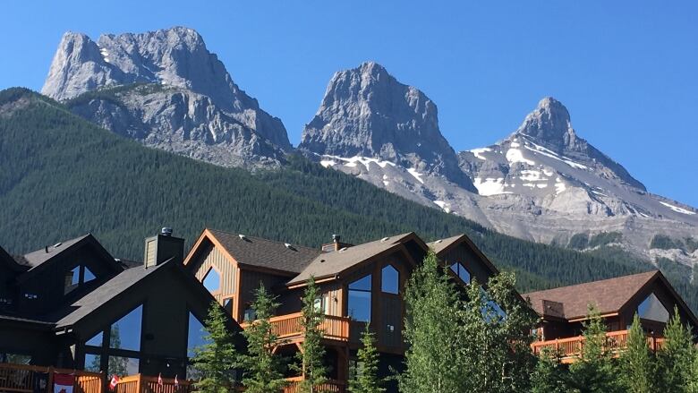 The Three Sisters housing development is shown under the mountain peaks from which it takes its name. 