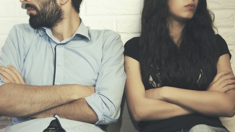 Man and woman are offended on brick wall background