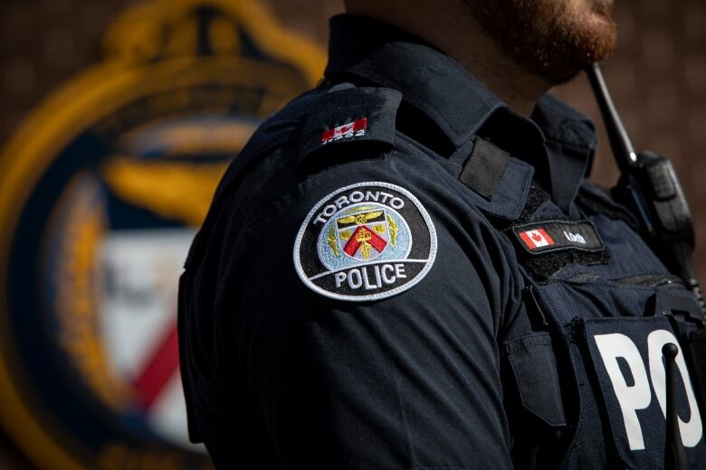 A Toronto Police office uniform logo is pictured. 