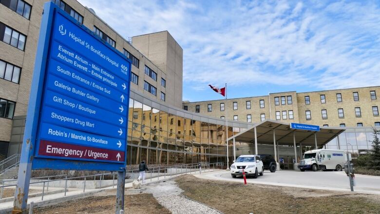 Exterior view of the St. Boniface Hospital with blue sign. 