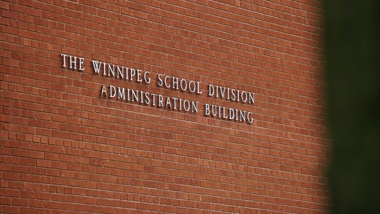 A brick wall with lettering.