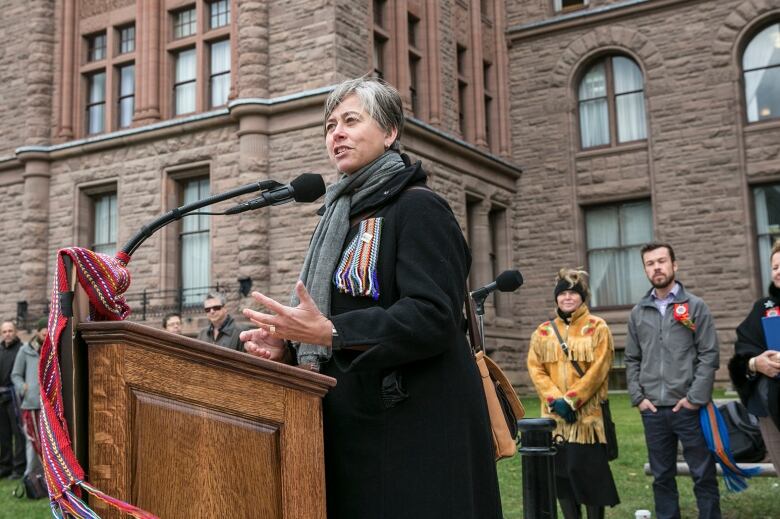 Margaret Froh speaks at a rally.