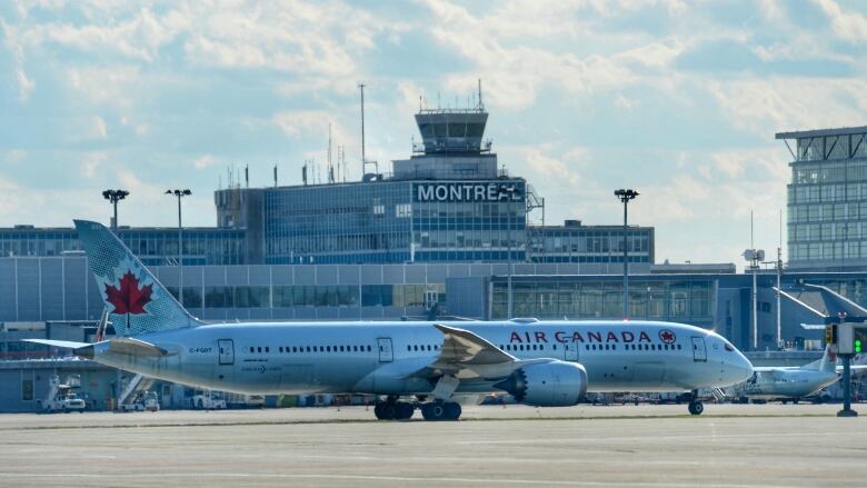 An airplane on the runway of the airport.