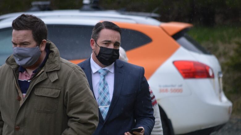 a man looks worried walking to court