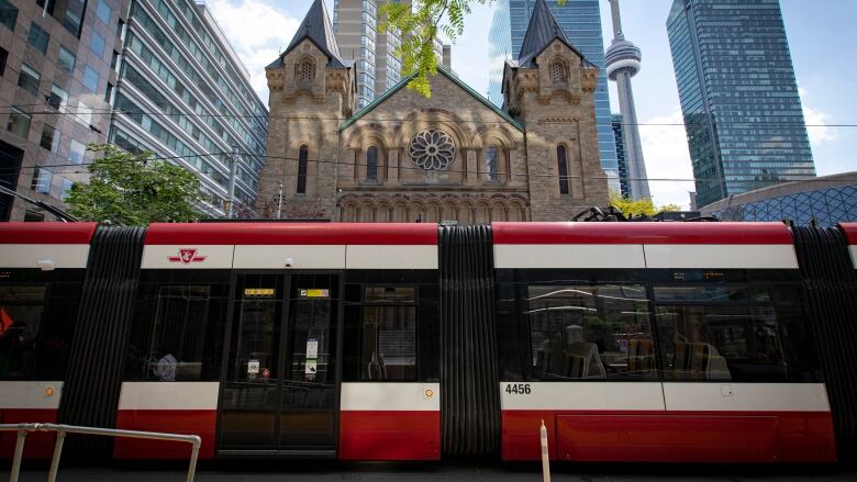 A Toronto Transit Commission streetcar driver pauses for a moment of silence at 2:15 p.m. on June 1, 2021, in recognition of the 215 children found buried on the grounds of the Kamloops residential school by the Tk'emlps te Secwpemc First Nation in B.C. 