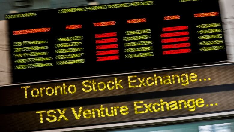 A sign board displaying Toronto Stock Exchange (TSX) stock information is seen in Toronto.