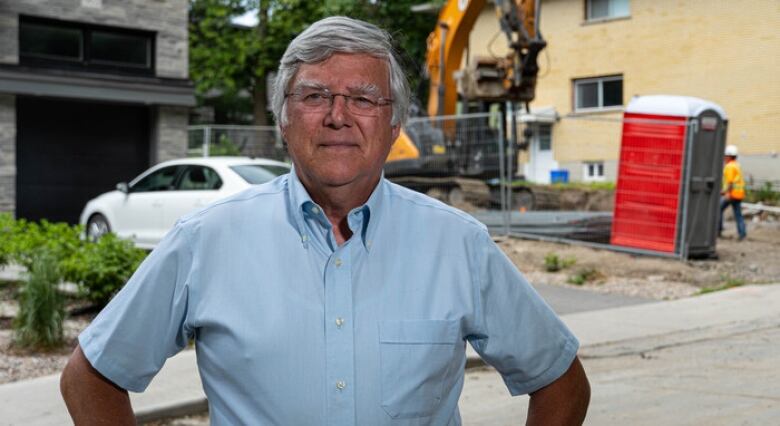 Alex Cullen, president of the Federation of Citizens' Associations of Ottawa, stands near infill development in June 2021.