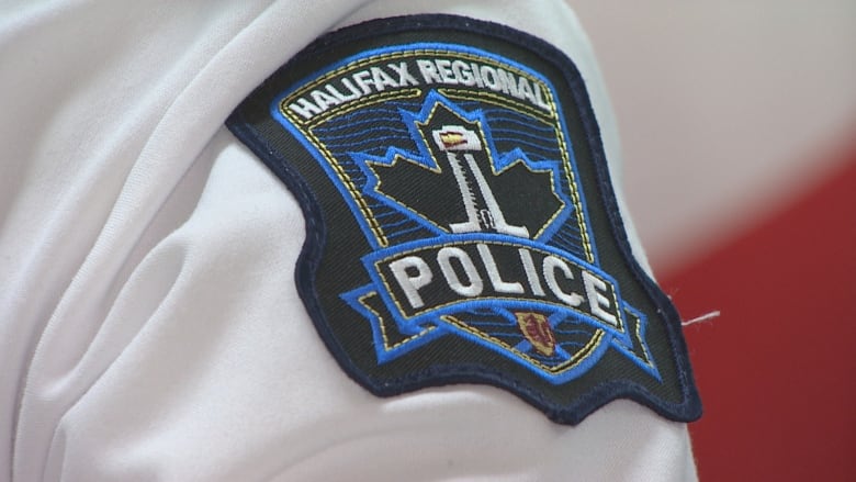 A patch on an arm that says Halifax Regional Police.