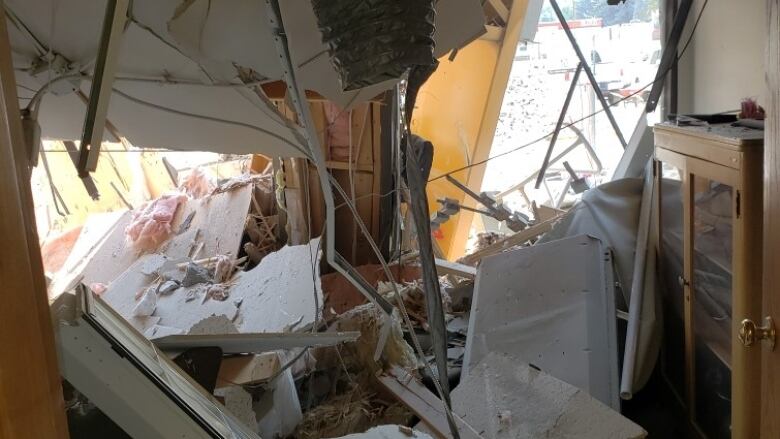 Rubble is seen inside of a heavily damaged office building.