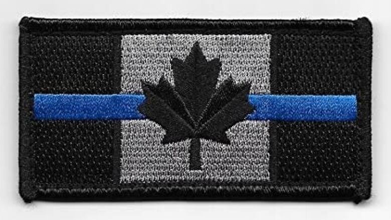 A monochromatic Canadian flag is bisected by a thin blue line.