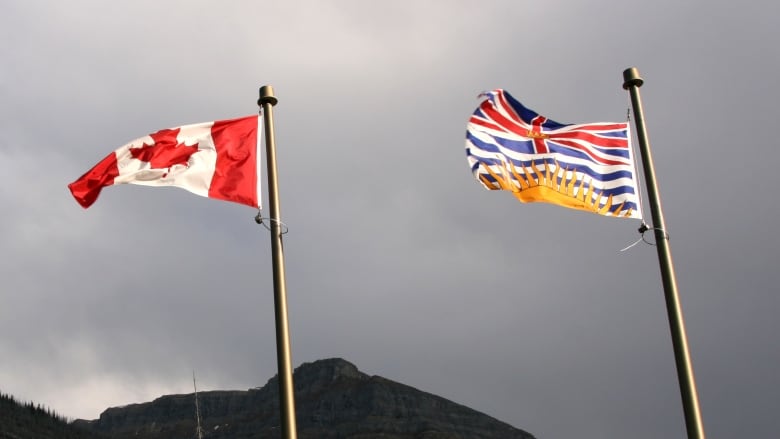 A B.C. flag is shown at right, flying alongside the Canadian flag.