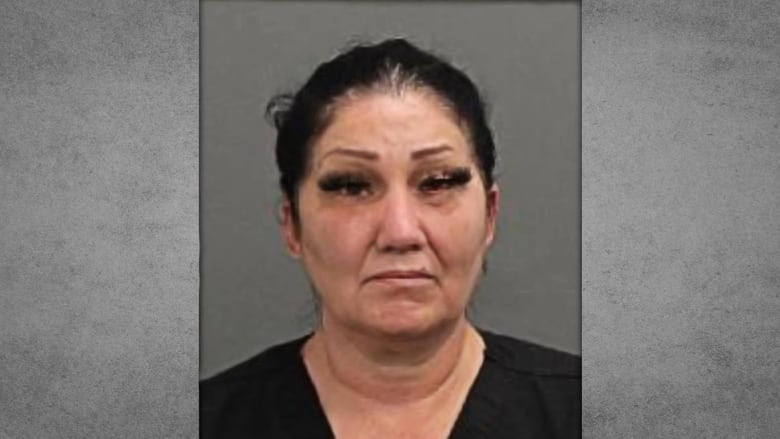 Brigitte Cleroux looks neutral in a mugshot. She is an Indigenous woman wearing black.