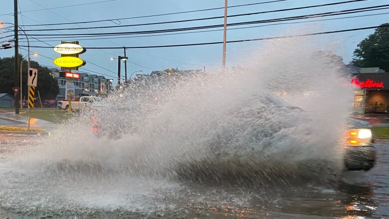 A vehicle on a flooded street in Charlottetown.