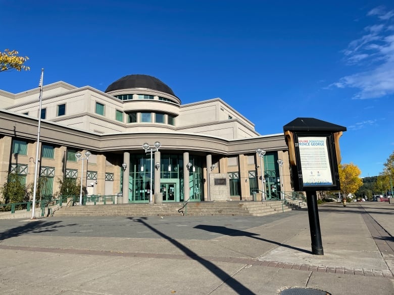 The Prince George courthouse building, with light green accents around the stonework.