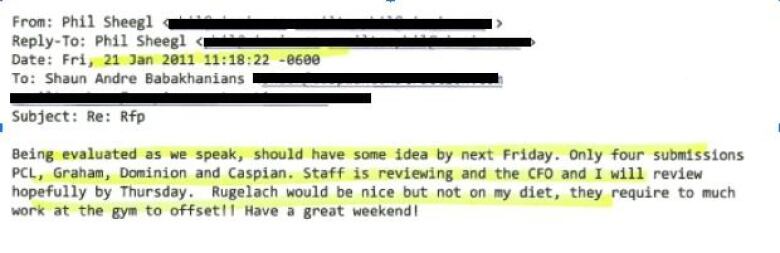 A photo shows an email, with some text highlighted in yellow and some blacked out.