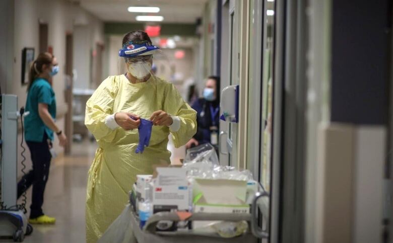 Staff members work at an ICU in an Alberta hospital during the COVID-19 pandemic.