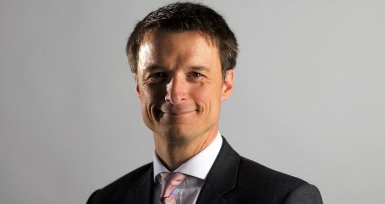 Portrait of smiling man in suit and tie