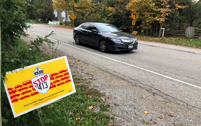 Opponents of the proposed GTA West Highway display a lawn sign in Belfountain, part of the town of Caledon. The proposed 52-kilometre-long Highway 413 would connect Vaughan to Milton by cutting through Caledon.   