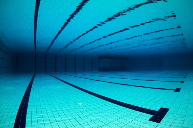 Underwater at an empty indoor swimming pool