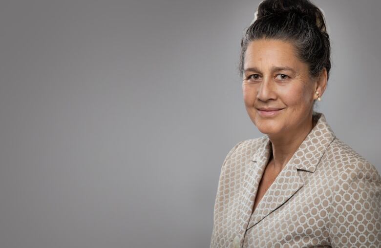 woman standing in front of grey background