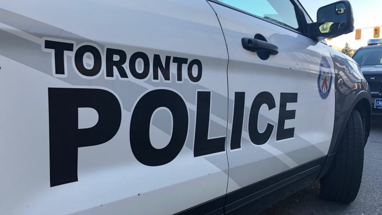 A closeup of the doors on a Toronto police cruiser.