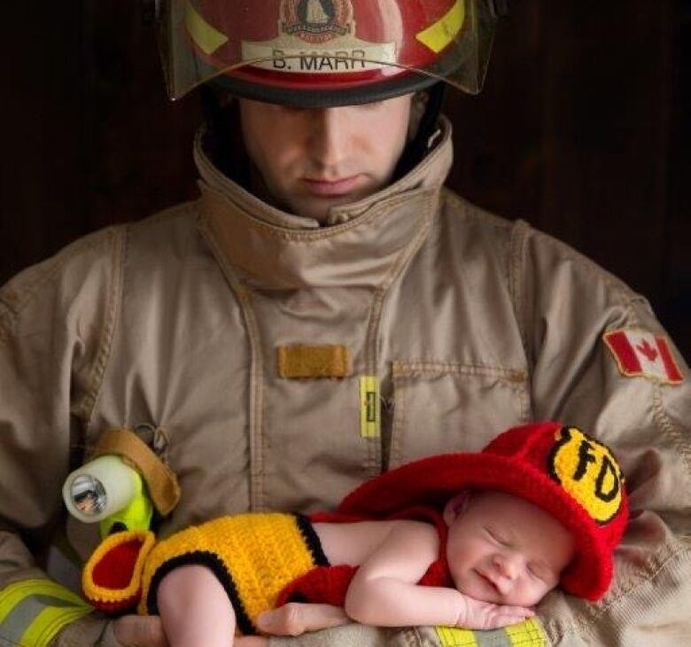 Halifax firefighter Billy Marr, who has cancer, is shown holding his newborn son Brody in January 2016.