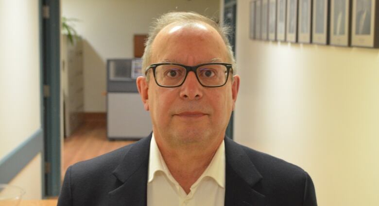 Head shot of Ray Racette in hallway of hospital.