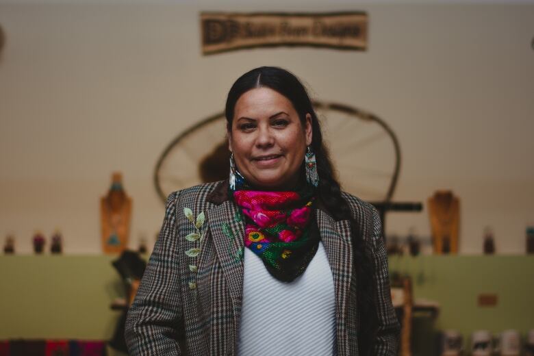 A woman poses for a portrait. 