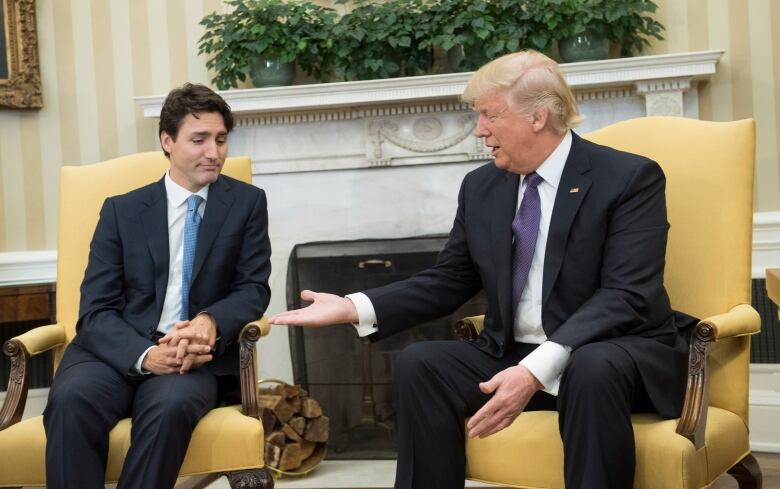 U.S. President Donald Trump, right, extends his hand to Prime Minister Justin Trudeau of Canada during a meeting in the Oval Office at the White House on Feb. 13, 2017, in Washington, D.C.