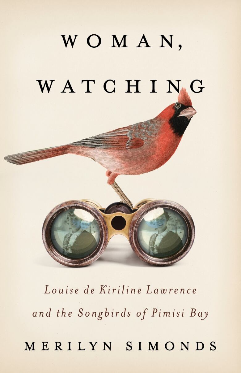 A beige book cover with a red bird sitting on a pair of binoculars. 