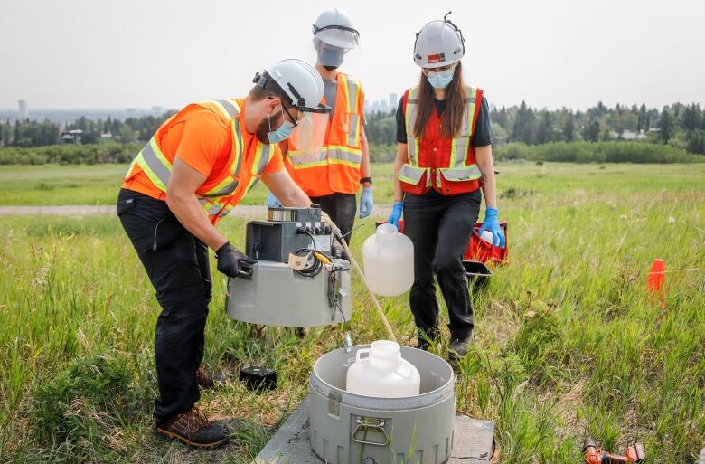 University of Calgary researchers check monitoring equipment as they track traces of COVID-19 in the wastewater system in  Calgary, Alta., Wednesday, July 14, 2021.