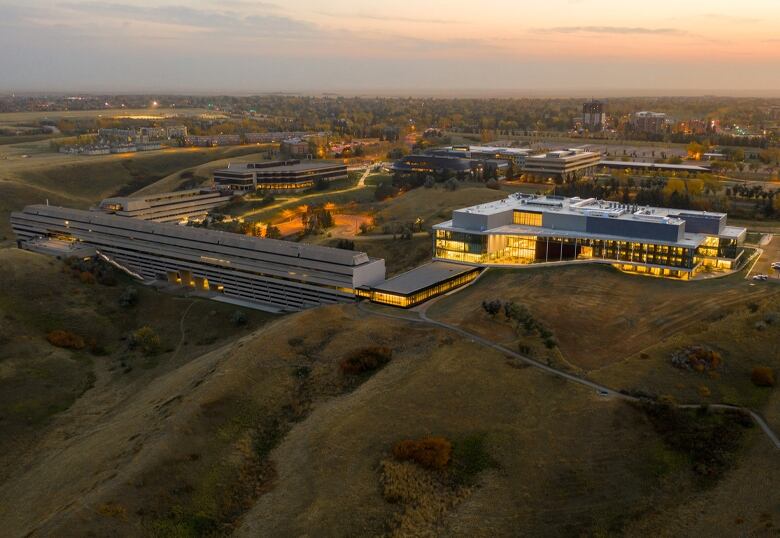 The exterior of a school is seen, from the sky.