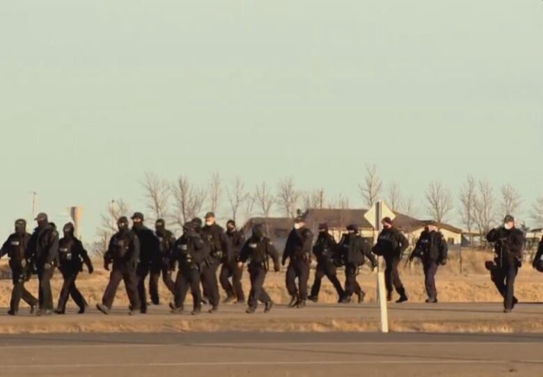 RCMP officers in a line at the Coutts blockade.