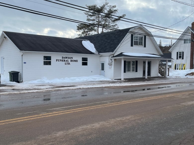 Dawson Funeral Home, with snow on roof.