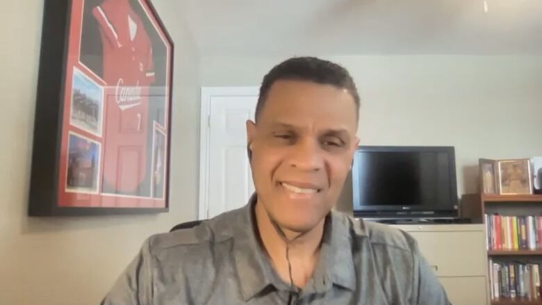 A Black man sitting at a desk