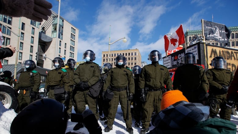 Police from across the country enforce an injunction against protesters camped near Parliament Hill, in Ottawa, on Feb. 18, 2022.