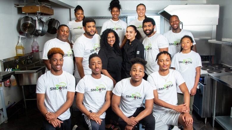 A group of Black people in a photo standing in a commercial kitchen