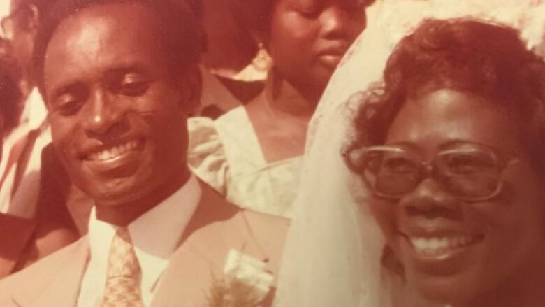 A old image of two Black people on their wedding day