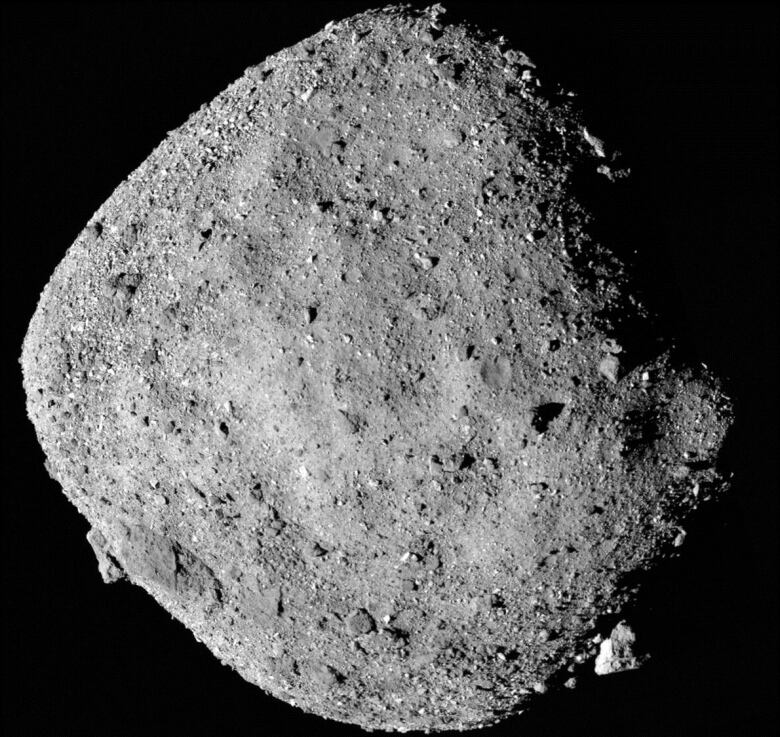 This mosaic image of asteroid Bennu is composed of 12 images collected by the OSIRIS-REx spacecraft from 24 km away.